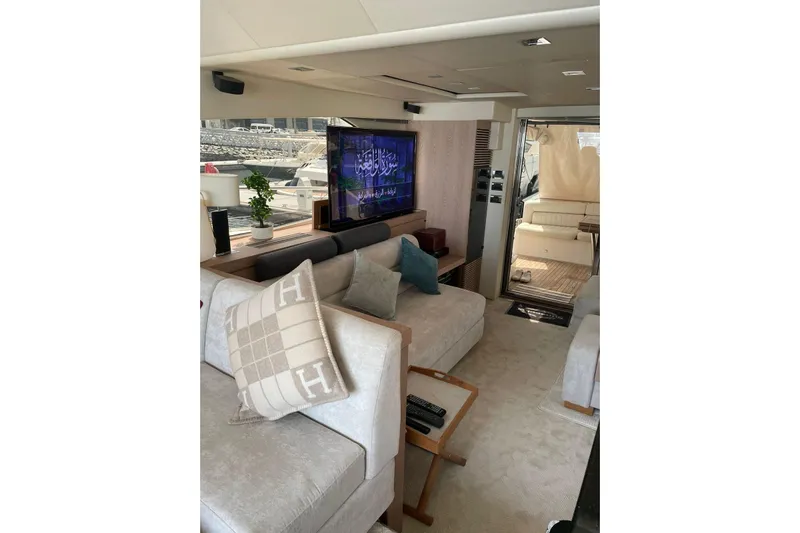  Yacht Photos Pics Luxurious interior of 2012 Sunseeker Manhattan 70 yacht with plush seating and modern decor.