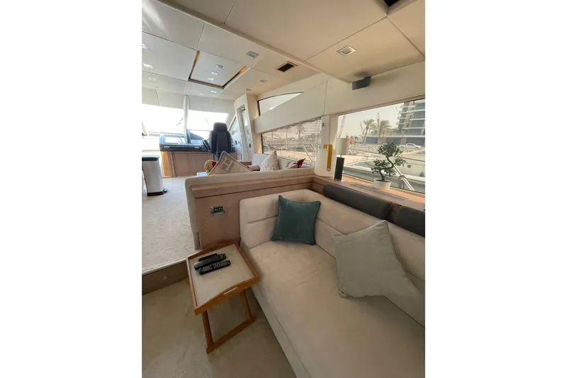  Yacht Photos Pics Luxurious interior of 2012 Sunseeker Manhattan 70 yacht with plush seating and modern decor.