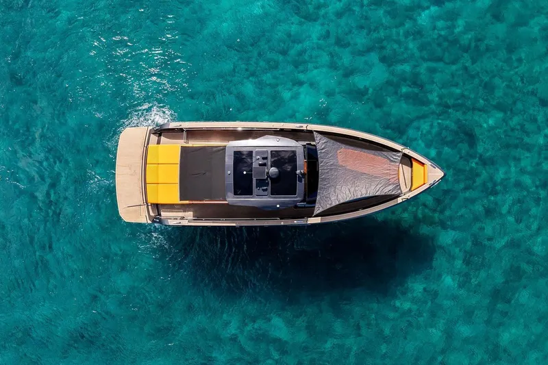 La Do&ntilde;a Yacht Photos Pics Overhead view of 2023 Pardo Yachts 50 on clear turquoise water.
