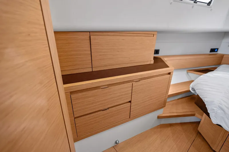La Do&ntilde;a Yacht Photos Pics Luxurious interior of 2023 Pardo Yachts 50, featuring elegant wooden cabinetry and modern design.