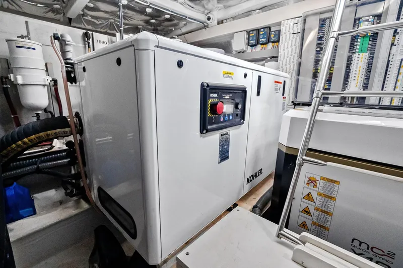 La Do&ntilde;a Yacht Photos Pics Engine room of 2023 Pardo Yachts 50 featuring Kohler generator and control panel.