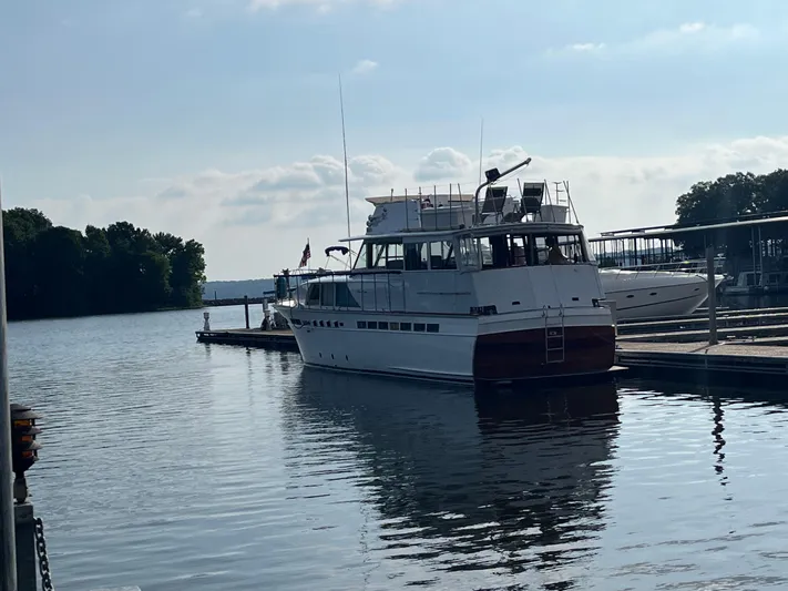 Yacht Photos Pics 1966 Chris-Craft 57 Constellation yacht docked on a calm lake.