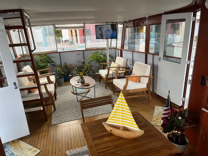  Yacht Photos Pics Interior of 1966 Chris-Craft 57 Constellation yacht with cozy seating and decor.