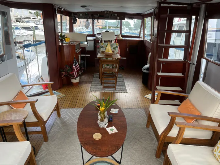  Yacht Photos Pics Interior of a 1966 Chris-Craft 57 Constellation yacht with elegant wooden furnishings.