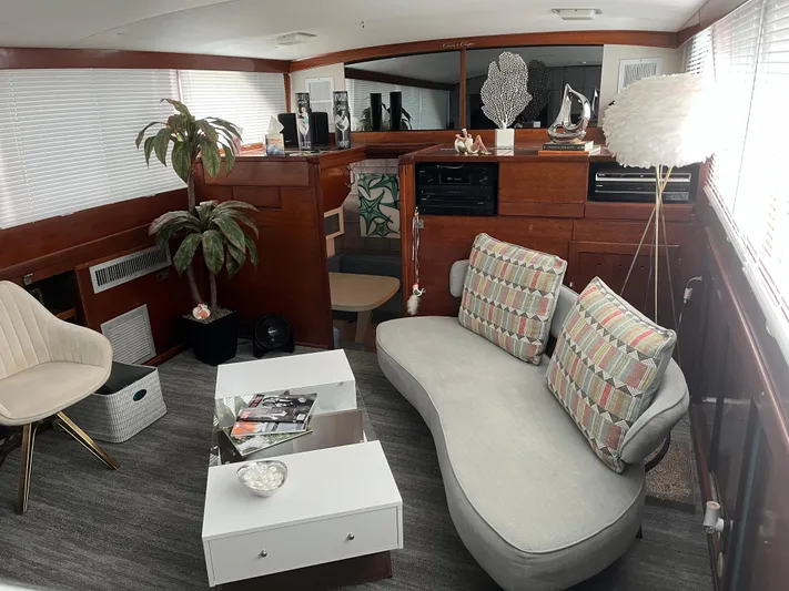  Yacht Photos Pics Luxurious interior of a 1966 Chris-Craft 57 Constellation yacht with modern decor and seating.