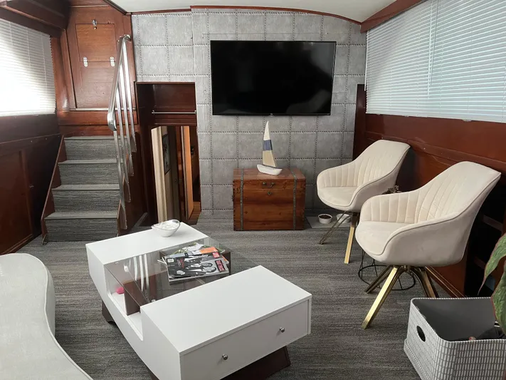  Yacht Photos Pics Luxurious interior of a 1966 Chris-Craft 57 Constellation yacht with modern decor.