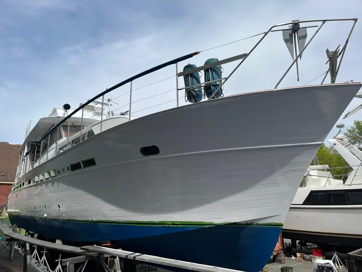  Yacht Photos Pics 1966 Chris-Craft 57 Constellation yacht on dry dock, showcasing sleek design and classic elegance.