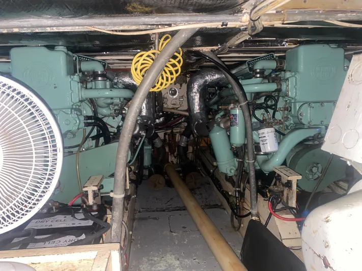  Yacht Photos Pics Engine room of a 1966 Chris-Craft 57 Constellation with twin engines and mechanical components.