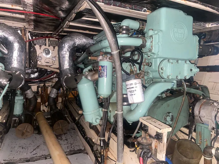  Yacht Photos Pics Engine room of a 1966 Chris-Craft 57 Constellation yacht, showcasing vintage machinery.