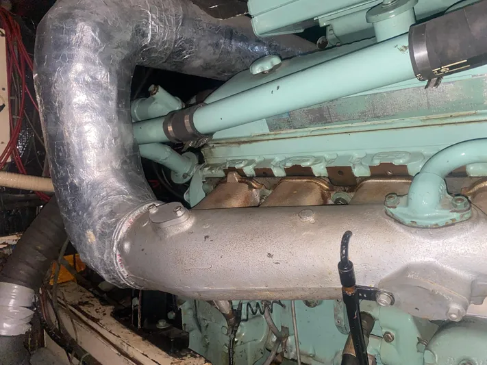  Yacht Photos Pics Engine compartment of a 1966 Chris-Craft 57 Constellation boat, showcasing mechanical components.