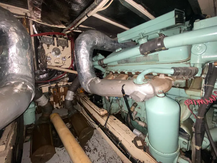  Yacht Photos Pics Engine room of a 1966 Chris-Craft 57 Constellation yacht, showcasing mechanical components.