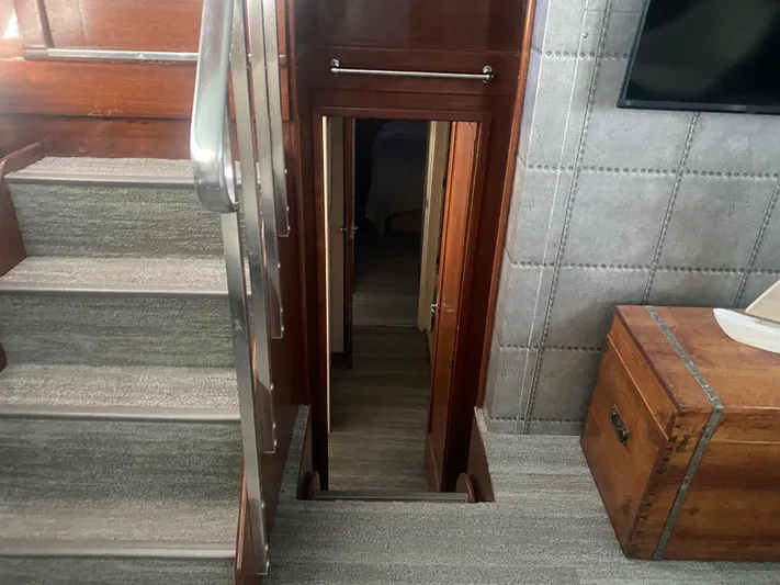  Yacht Photos Pics Interior of 1966 Chris-Craft 57 Constellation yacht with stairs and wooden decor.