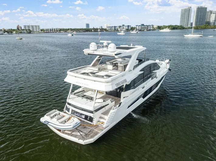 Live More Yacht Photos Pics Luxury 2021 Galeon 680 Fly yacht cruising on a scenic waterfront.