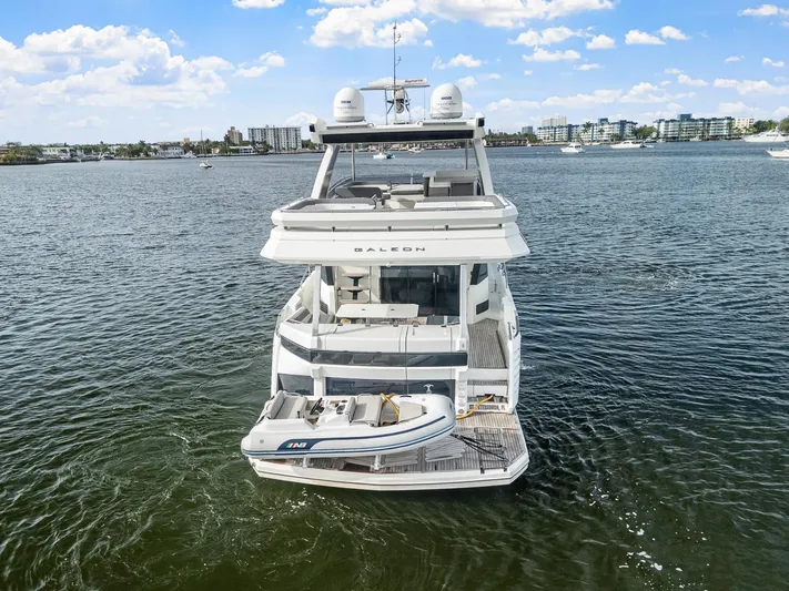 Live More Yacht Photos Pics 2021 Galeon 680 Fly yacht on water, rear view with tender boat.
