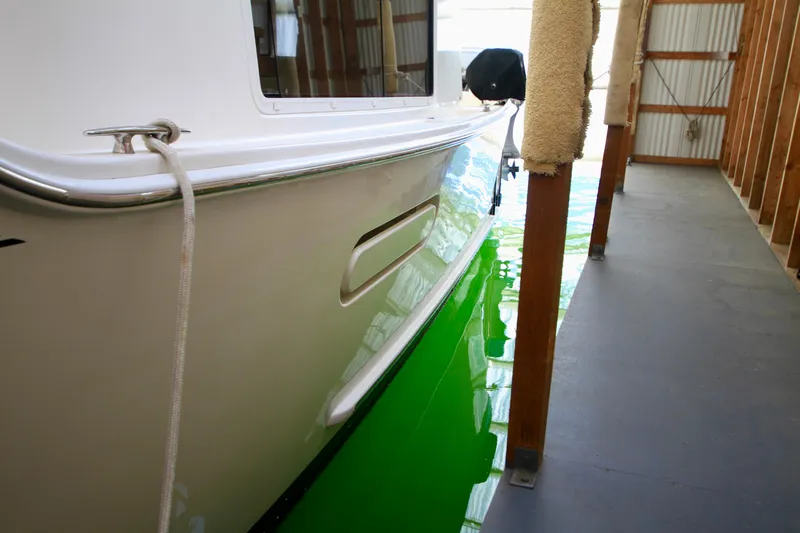  Yacht Photos Pics 2011 Fathom Element 43 boat docked in a covered marina.