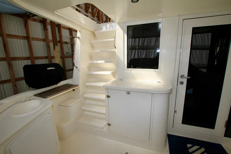  Yacht Photos Pics Interior of 2011 Fathom Element 43 boat with stairs and cabinetry.