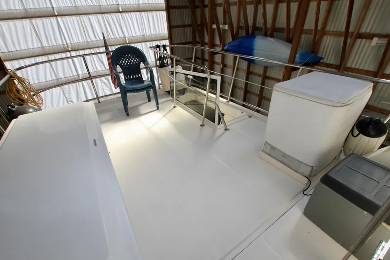  Yacht Photos Pics Rooftop deck of 2011 Fathom Element 43 boat with chair and storage.