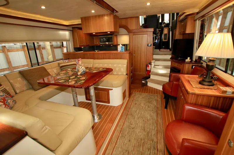  Yacht Photos Pics Luxurious interior of 2011 Fathom Element 43 yacht with elegant seating and wooden finishes.