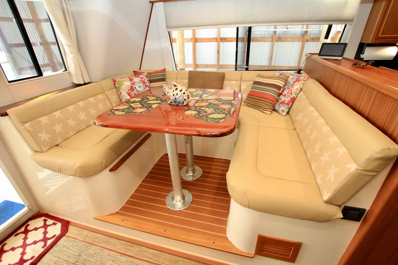  Yacht Photos Pics Luxurious 2011 Fathom Element 43 yacht interior with cozy seating and decorative pillows.