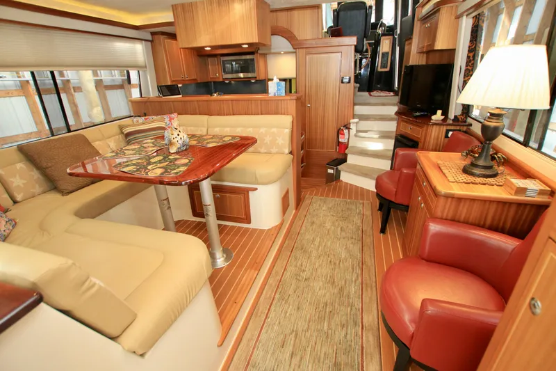  Yacht Photos Pics Luxurious interior of 2011 Fathom Element 43 yacht with elegant seating and wooden finishes.
