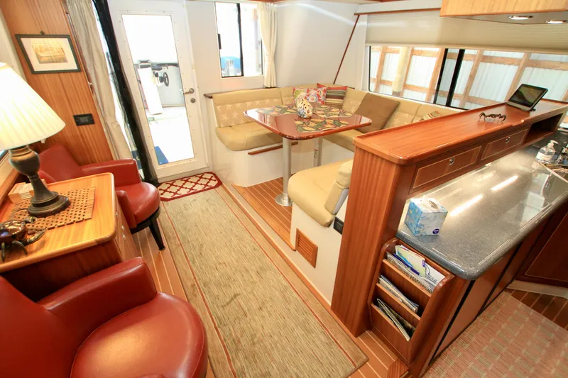  Yacht Photos Pics Luxurious interior of 2011 Fathom Element 43 yacht with elegant seating and wooden finishes.