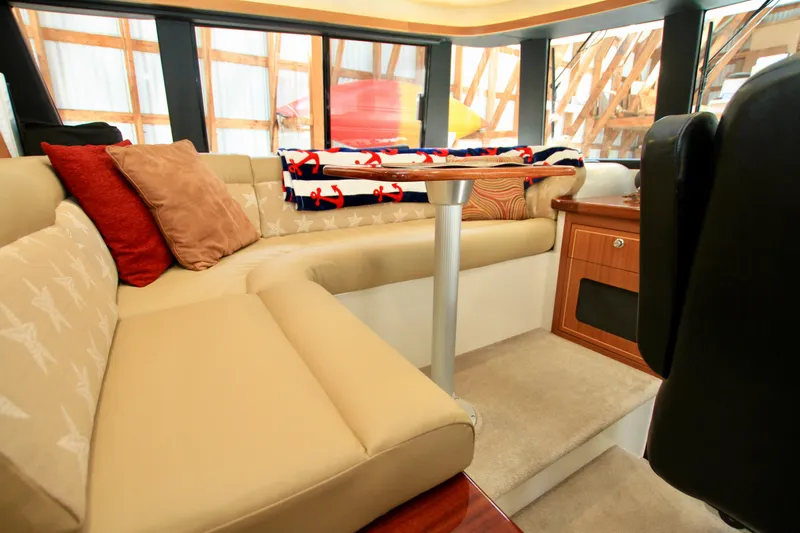  Yacht Photos Pics Luxurious interior of 2011 Fathom Element 43 yacht with cozy seating and nautical decor.