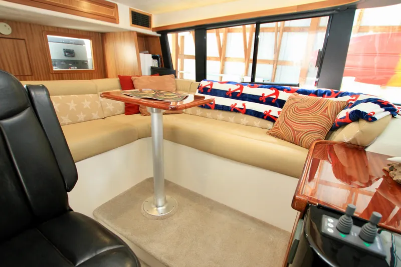  Yacht Photos Pics Luxurious interior of 2011 Fathom Element 43 yacht with cozy seating and nautical decor.