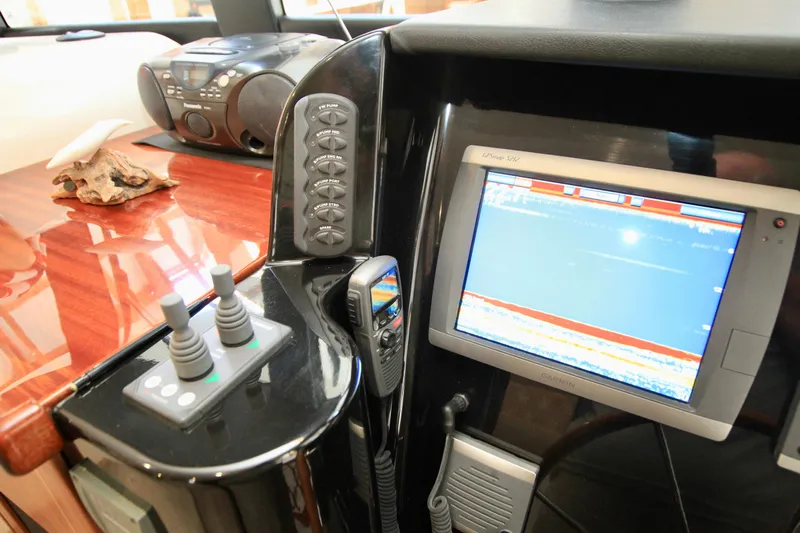  Yacht Photos Pics Control panel and display screen on 2011 Fathom Element 43 yacht interior.