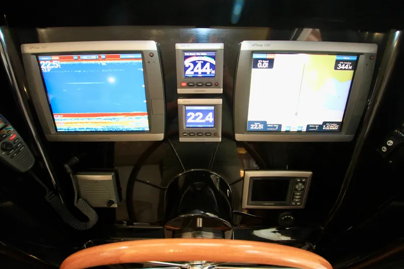  Yacht Photos Pics Boat dashboard with navigation screens and controls, Fathom Element 43, 2011 model.