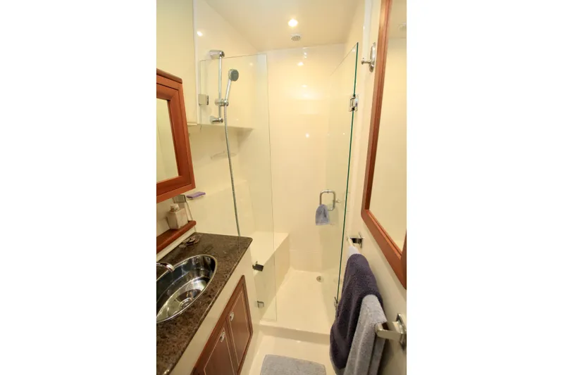  Yacht Photos Pics Compact bathroom with glass shower in 2011 Fathom Element 43 yacht.