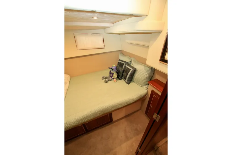  Yacht Photos Pics Cozy bedroom in 2011 Fathom Element 43 yacht with plush bedding and decorative pillows.