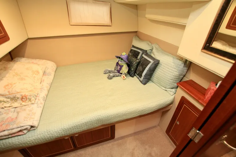  Yacht Photos Pics Cozy cabin bedroom in 2011 Fathom Element 43 yacht with plush bedding and decor.