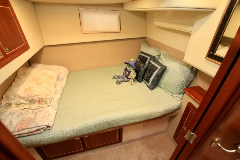 Yacht Photos Pics Cozy cabin bedroom in 2011 Fathom Element 43 yacht with plush bedding and decor.
