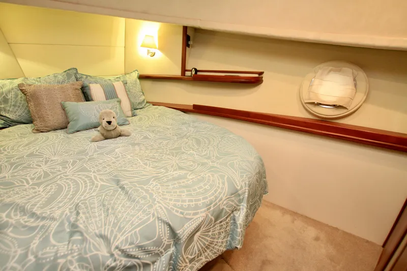 Yacht Photos Pics Cozy bedroom in 2011 Fathom Element 43 yacht with plush bedding and soft lighting.