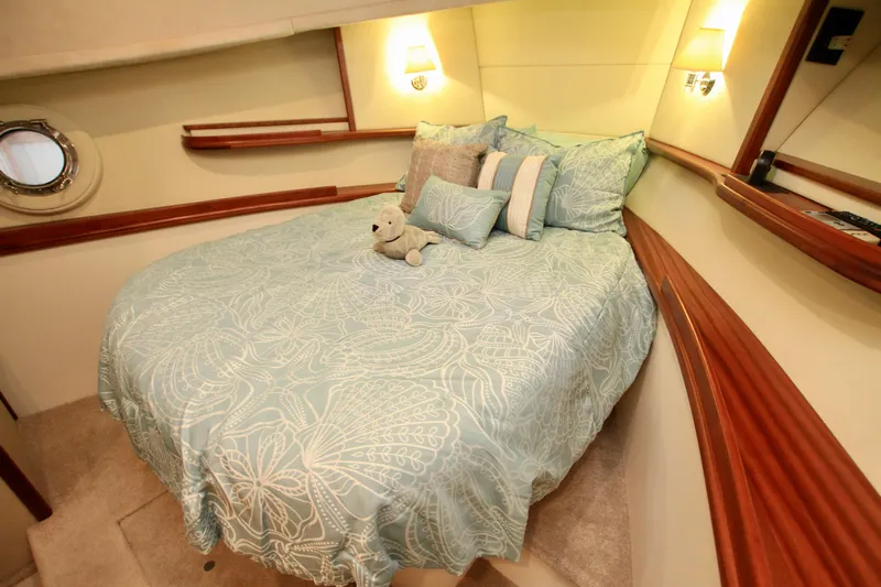  Yacht Photos Pics Luxurious cabin interior of 2011 Fathom Element 43 yacht with cozy bed and plush decor.