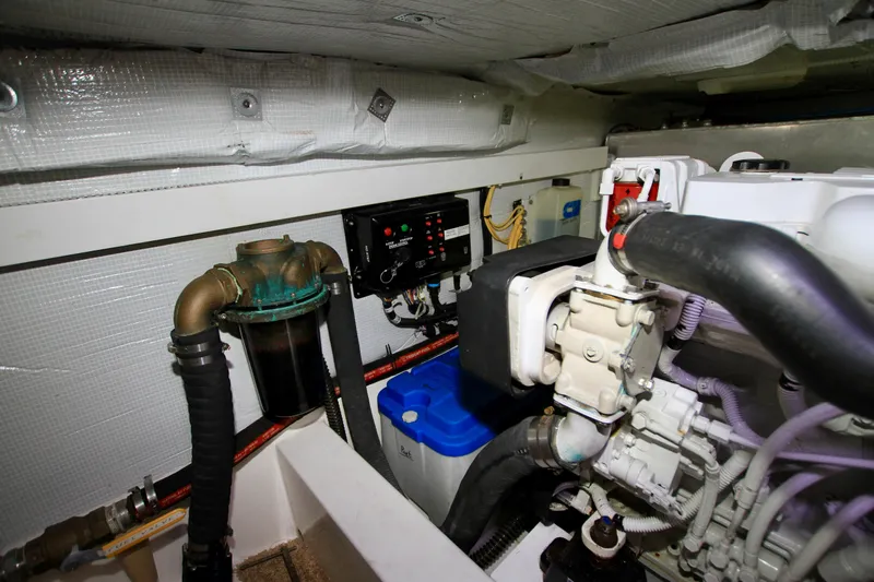  Yacht Photos Pics Engine room of 2011 Fathom Element 43 with mechanical components and control panel.