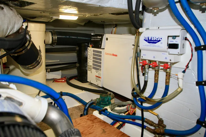  Yacht Photos Pics Engine room of 2011 Fathom Element 43 with Cummins Onan generator and Reverso oil system.