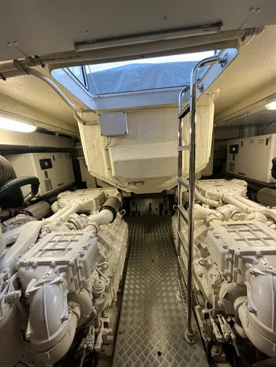  Yacht Photos Pics Engine room of 2017 Riva 76' Perseo yacht with dual engines and ladder access.