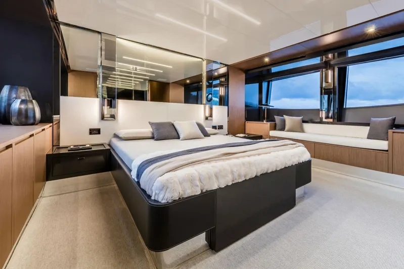  Yacht Photos Pics Luxurious bedroom interior on 2017 Riva 76' Perseo yacht with modern design and large windows.
