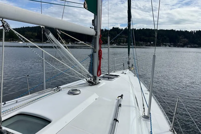 Tina C Yacht Photos Pics 2001 Beneteau 361 sailboat on calm water, showcasing deck and rigging.