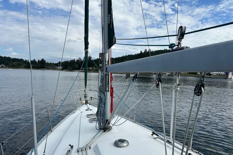 Tina C Yacht Photos Pics 2001 Beneteau 361 sailboat on calm water, showcasing deck and rigging.