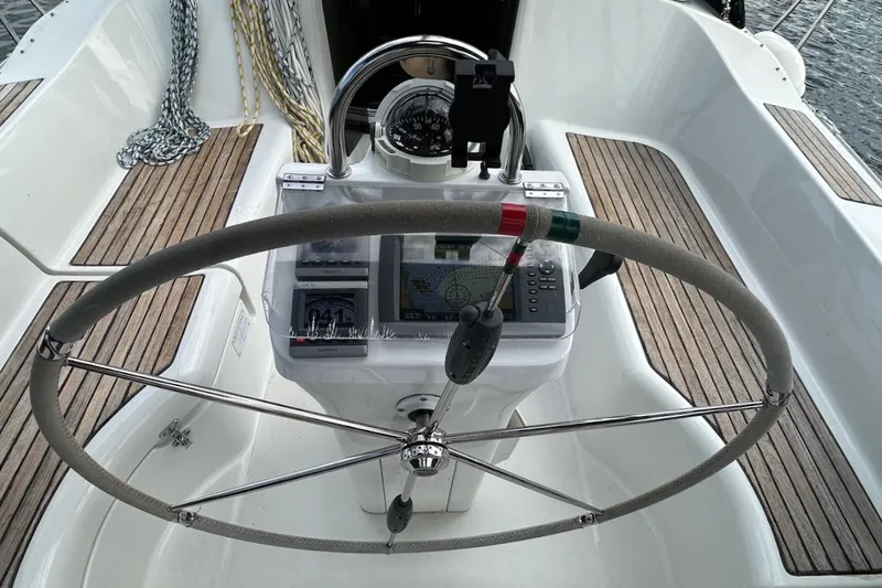 Tina C Yacht Photos Pics Steering wheel and navigation equipment on a 2001 Beneteau 361 sailboat cockpit.