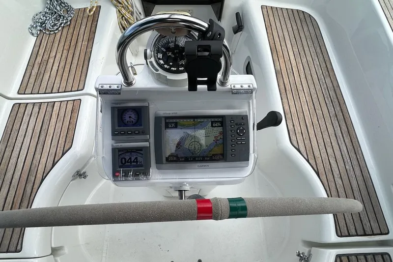 Tina C Yacht Photos Pics Steering console of a 2001 Beneteau 361 sailboat with navigation instruments and compass.