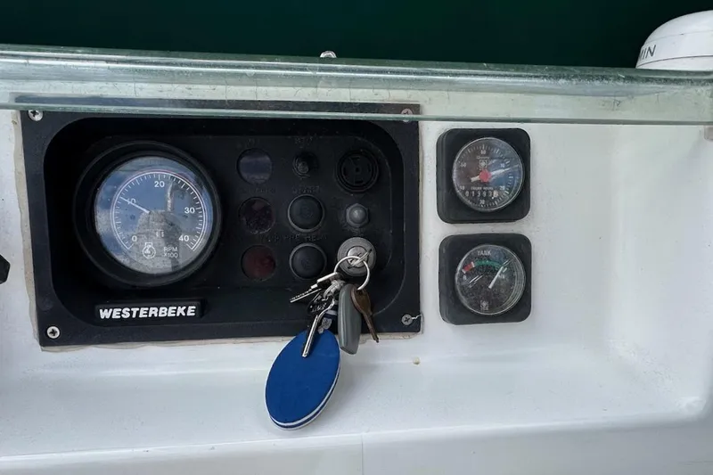 Tina C Yacht Photos Pics Control panel of a 2001 Beneteau 361 sailboat with gauges and keys.