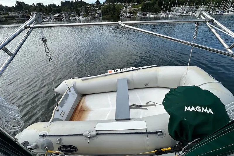 Tina C Yacht Photos Pics Beneteau 361 sailboat with dinghy and Magma grill, docked in a scenic marina, 2001 model.