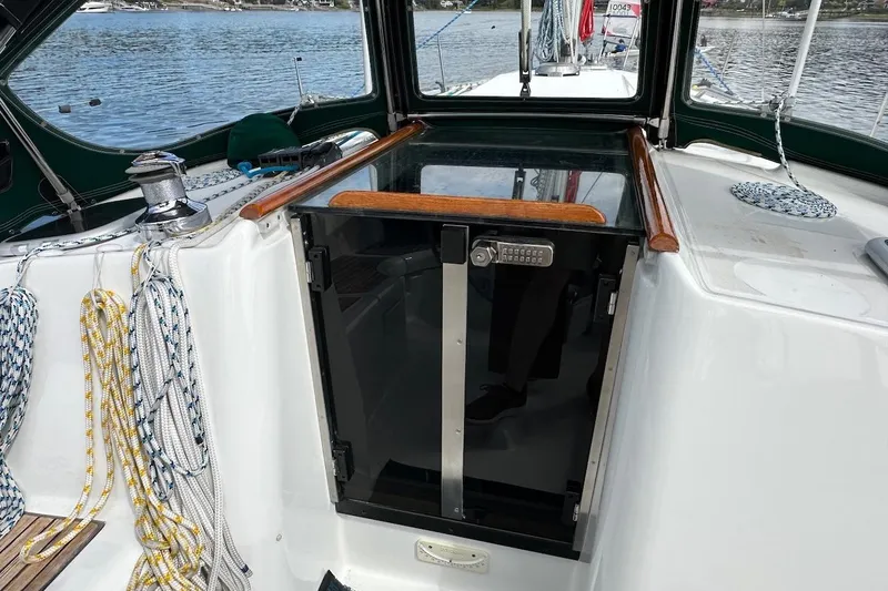 Tina C Yacht Photos Pics 2001 Beneteau 361 sailboat cockpit with ropes and secure cabin door.