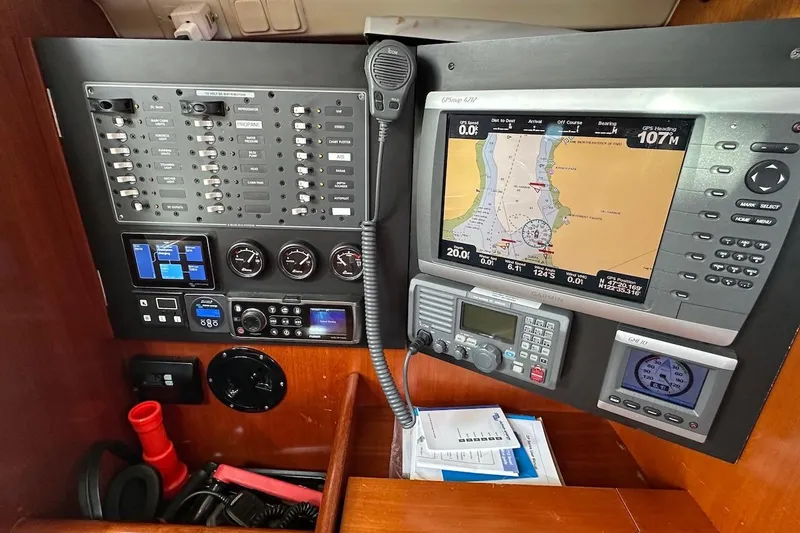 Tina C Yacht Photos Pics Control panel of a 2001 Beneteau 361 sailboat with navigation and communication equipment.