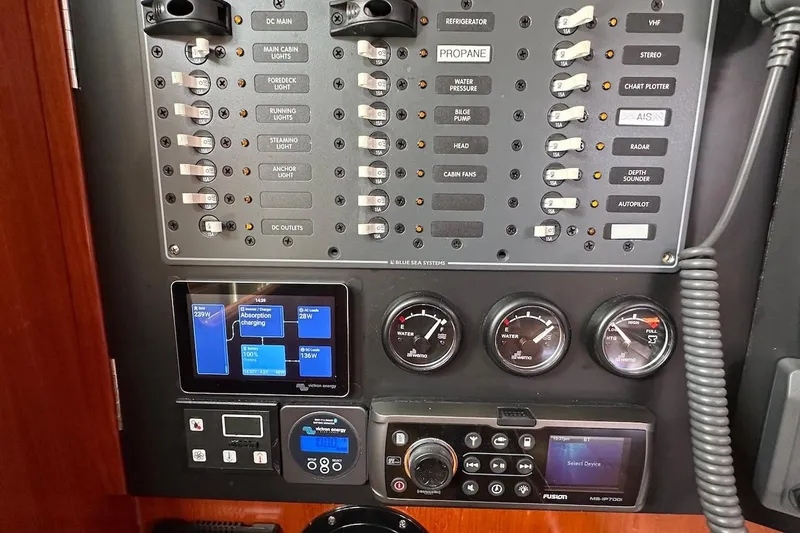 Tina C Yacht Photos Pics Control panel of a 2001 Beneteau 361 sailboat with gauges and switches.
