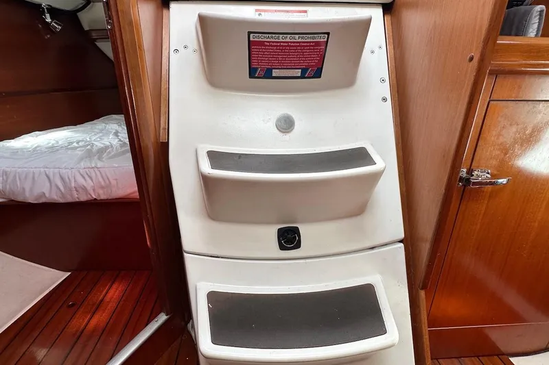 Tina C Yacht Photos Pics Interior of 2001 Beneteau 361 sailboat showing cabin steps and wooden flooring.