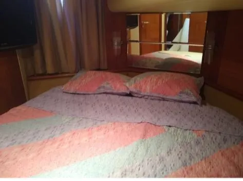  Yacht Photos Pics 2008 Azimut Flybridge yacht bedroom with colorful bedding.